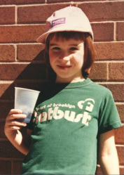 Image is a young girl in a Flatbush shirt